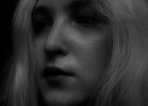 
A Grayscale of a Woman's Face