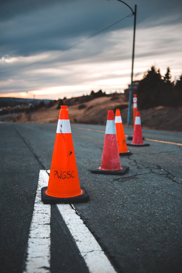 Safety Cones Placed On Asphalt Road