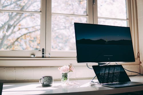 
A Laptop and a Monitor on a Desk