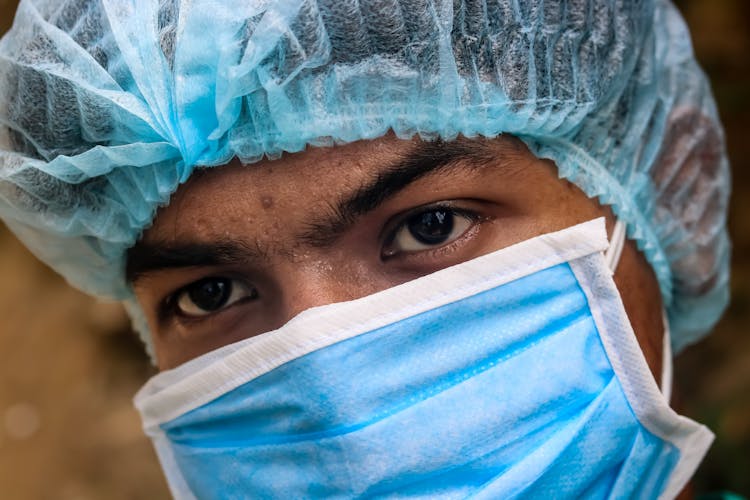 Crop Ethnic Male Doctor In Protective Mask And Hat