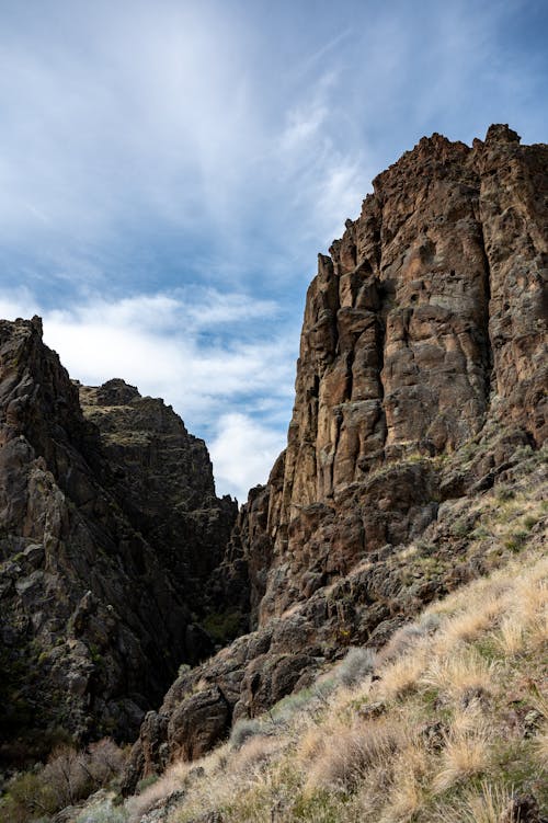 Rocky cliff in barren mountainous terrain