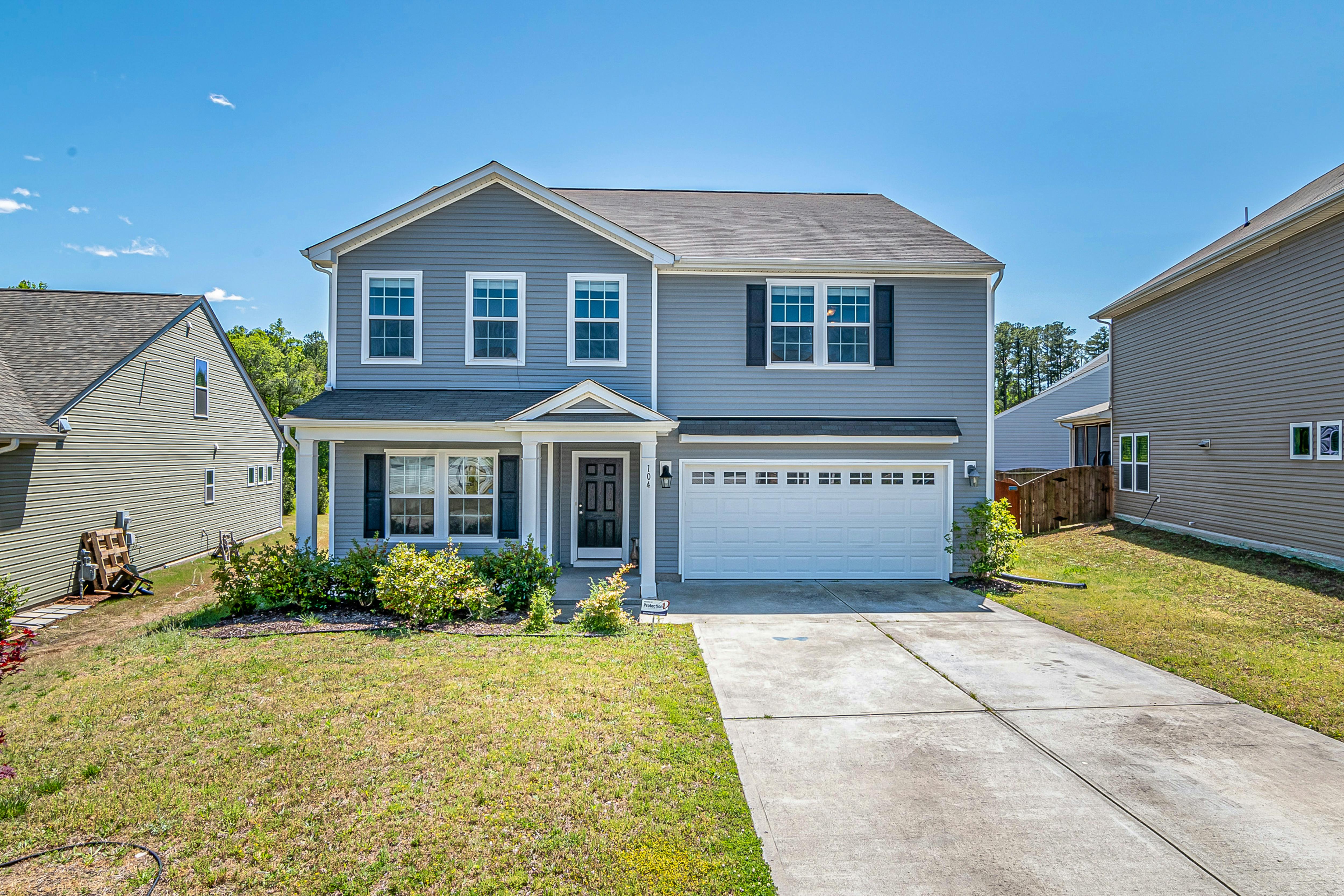 Image Alt Text: Single-family home with spacious front yard