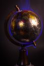 Earth globe burning in blue flames