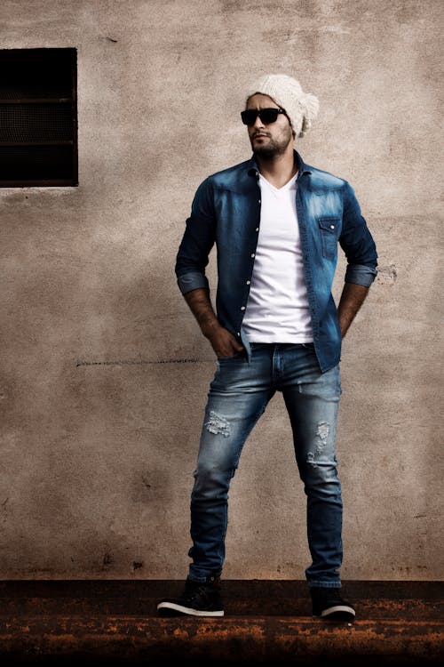 Full Shot of a Man in Ripped Jeans Standing