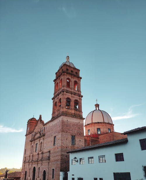 Low-Angle Shot of a Church Under Blue Sky