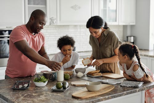 Free Family Making Breakfast in the Kitchen Stock Photo