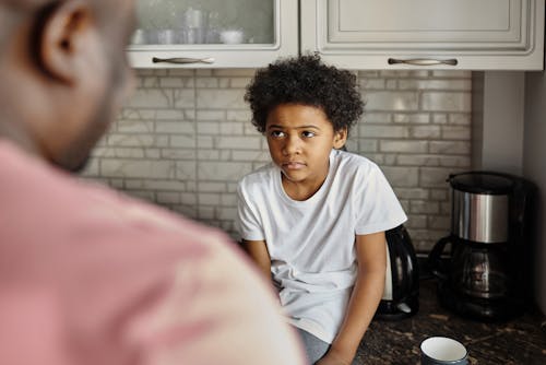 Little Boy Looking at his Father