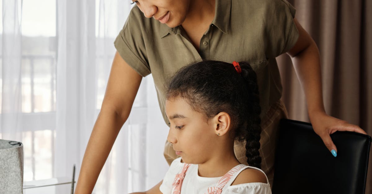 Immigration consultant sitting at a desk with a student discussing visa documents.