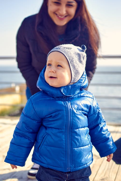 Photo of a Cute Kid Wearing a Blue Jacket