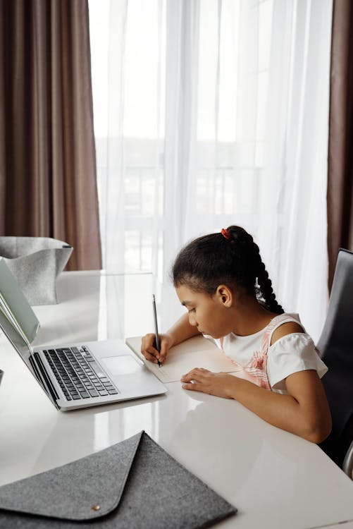 Little Girl Doing her Homework