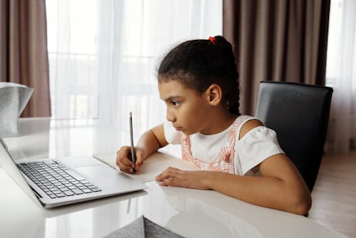 Little Girl Doing her Homework