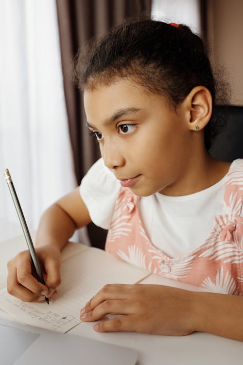 Free Little Girl Doing her Homework Stock Photo
