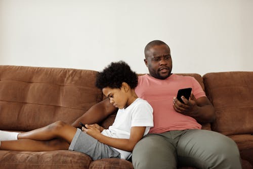 Father and Son using Smartphones