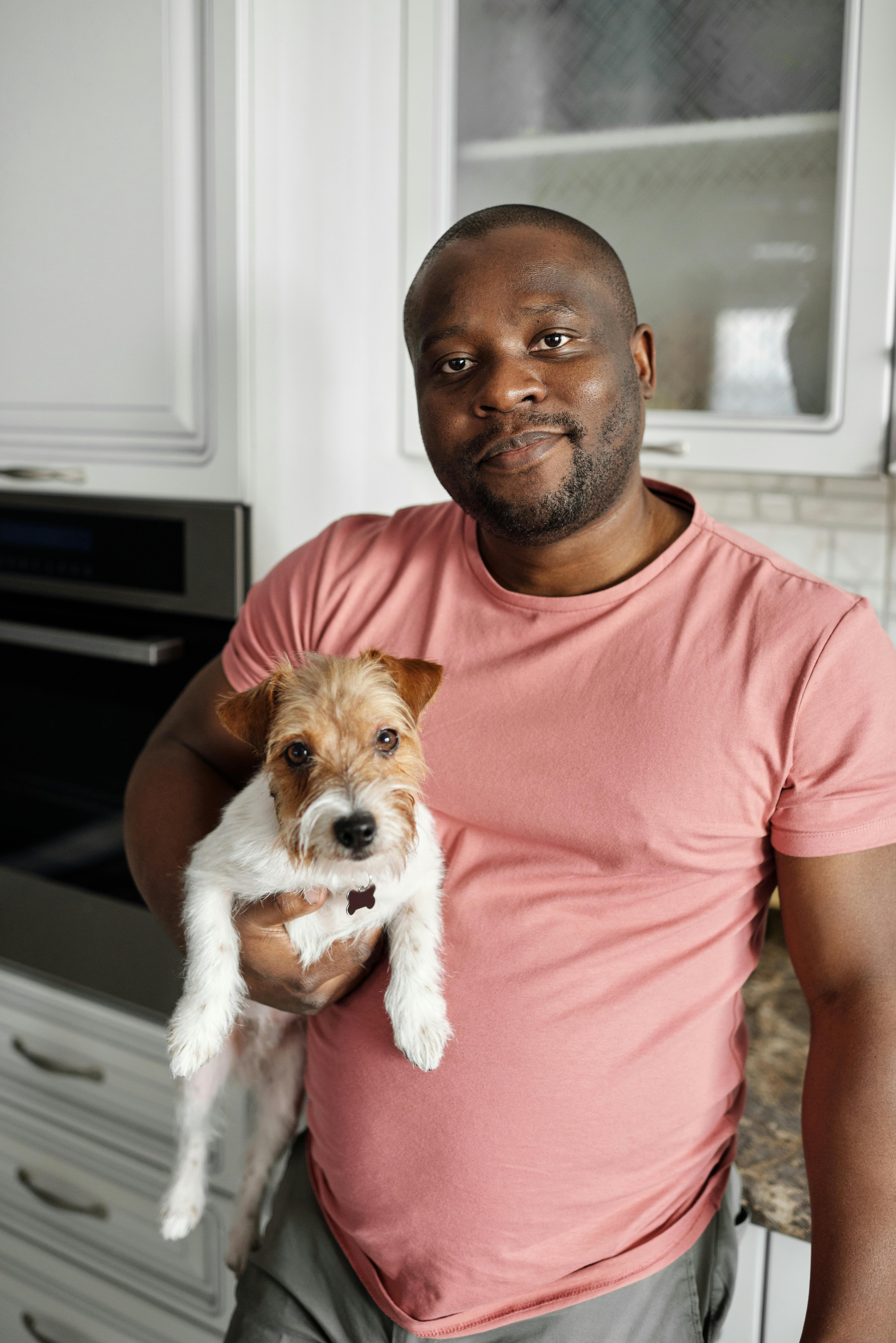 Man with a Louis Vuitton dog bag and small Yorkshire terrier Stock Photo -  Alamy