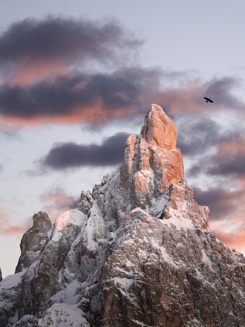 Free Close-Up Shot of a Snow Covered Rocky Mountain during Sunset Stock Photo