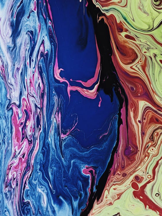 Abstract background of multicolored liquid paints · Free Stock Photo