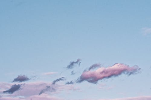 Colorful picturesque clouds in sky during sundown