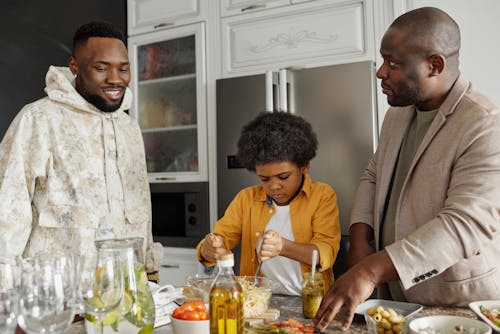 Men with a Child on a Kitchen