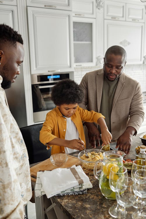 Father and Son Preparing Food at a Kitchen