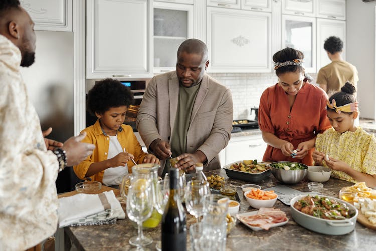 Family Preparing Food In The Kitchen