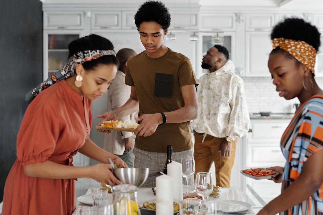 Free People Preparing the Table for Dinner Stock Photo