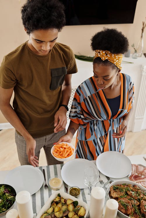 Free Family Setting the Table for Dinner Stock Photo