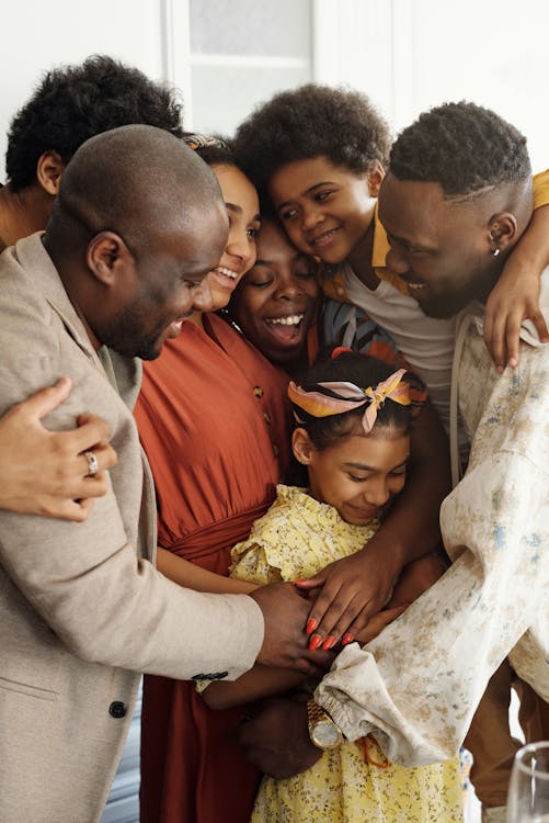 A black family having a group hug