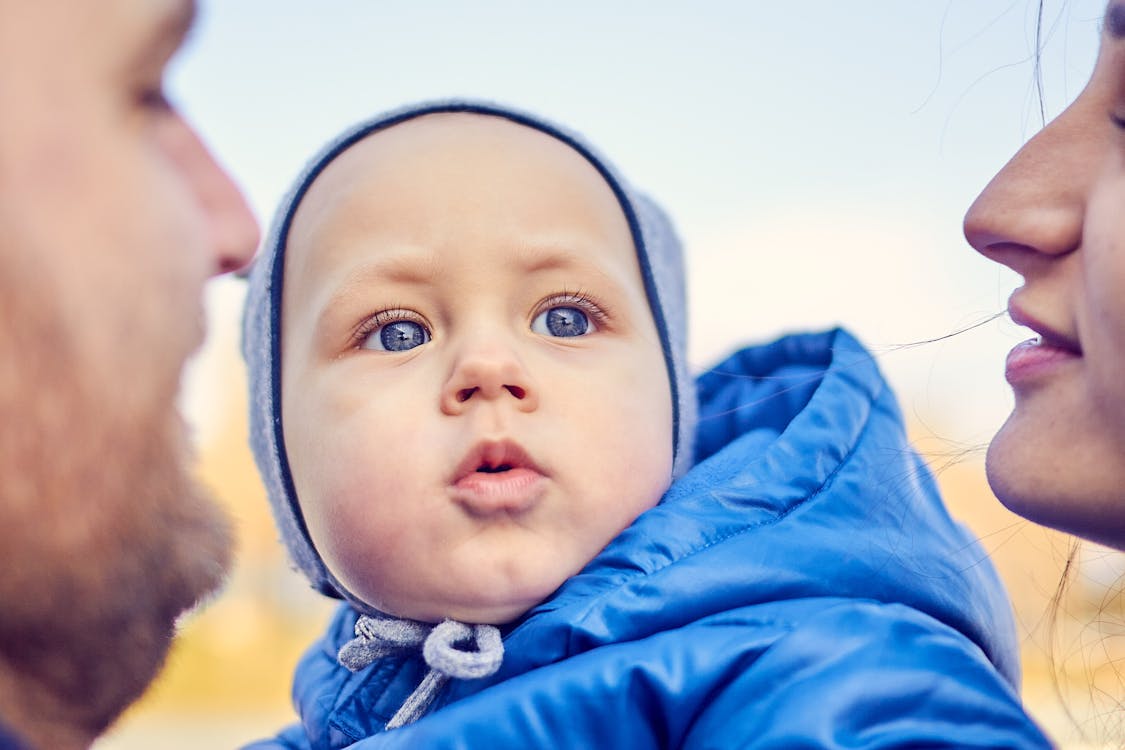 Close-Up Photo of a Cute Child with Blue Eyes