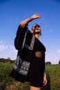 A Woman Modeling with her Hand Raised