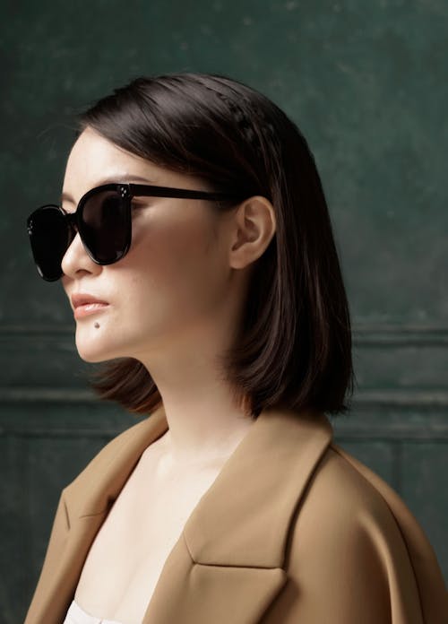 Portrait of a Woman Wearing Black Sunglasses