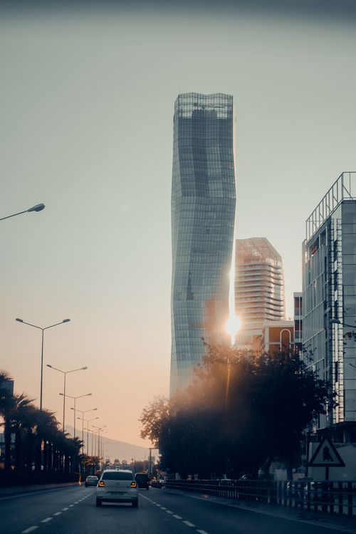 Free A striking view of a modern skyscraper in İzmir, Turkey, captured at sunset. Stock Photo