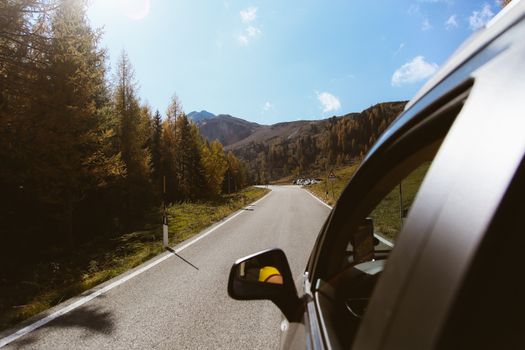 Experience an enchanting journey through the Dolomites with this picturesque road view.