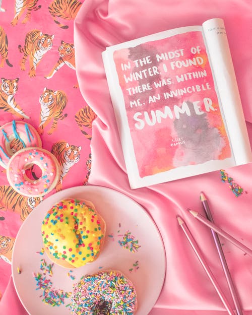 Magazine and Donuts on Pink Background