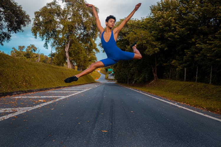 A Ballerino Dancing On A Road