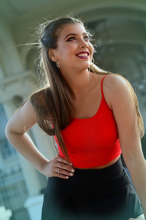 Free Cheerful young woman in red top Stock Photo