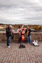 Street Performers Playing Music on a Bridge