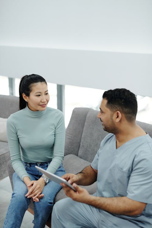 Free A Woman Talking to her Doctor Stock Photo
