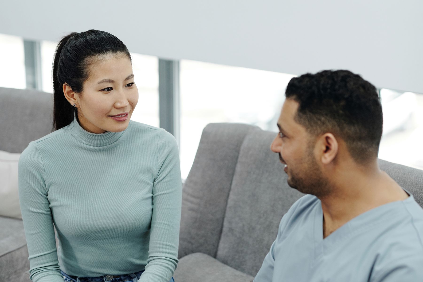 Doctor and prospective patient discussing goals in a private consultation room