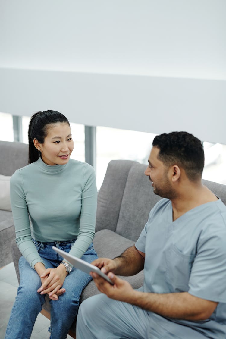 A Woman Talking To Her Doctor