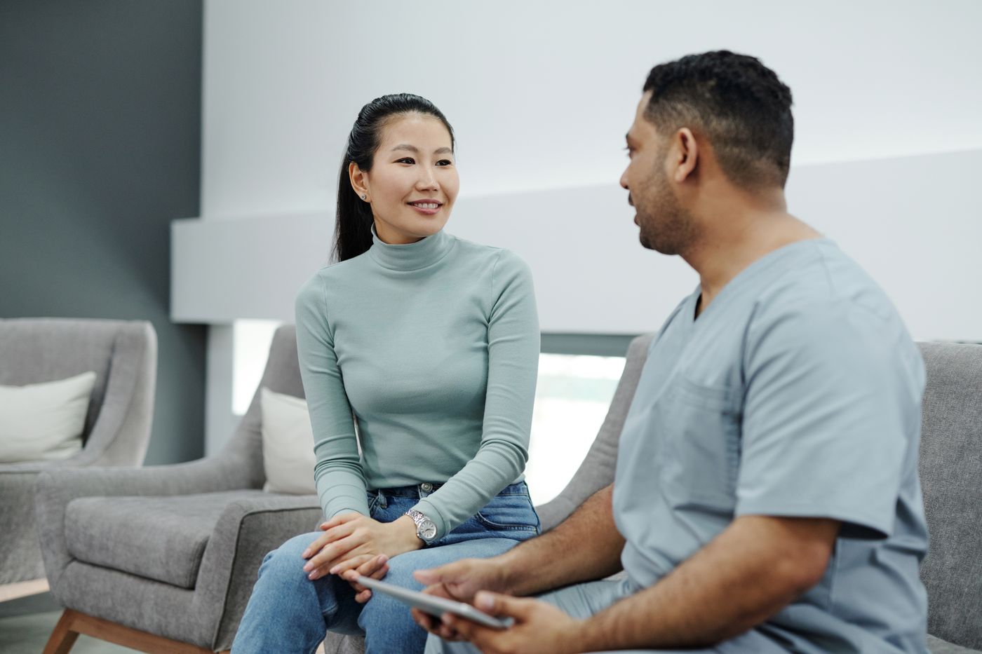 Healthcare professional discussing health and wellness with a patient