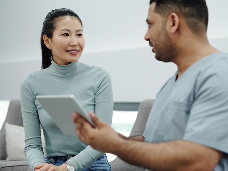 A doctor and patient talking in a modern clinic