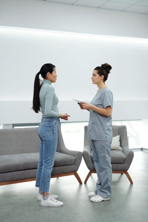 Free A Woman Talking to her Doctor Stock Photo