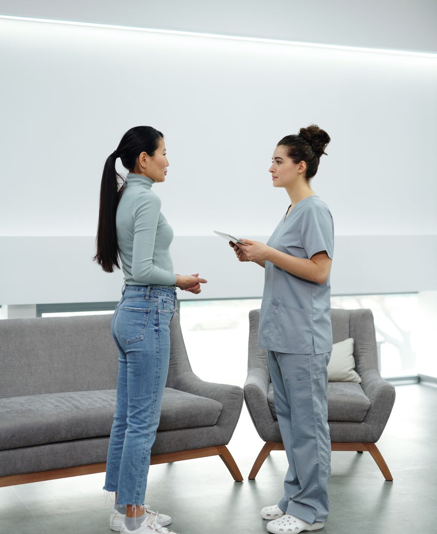 Clinician and patient speaking during a consultation