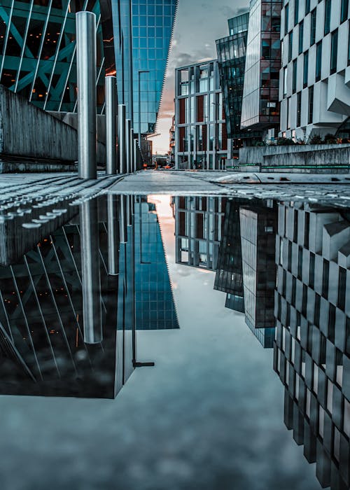 Free Ground Level Shot of a Puddle in an Urban Area Stock Photo