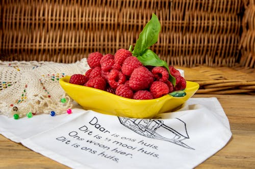 Free Red Raspberries in a Yellow Plate Stock Photo