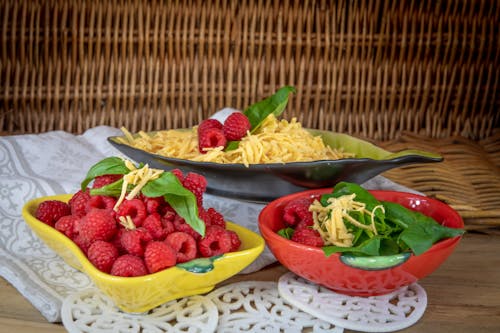 Close-up of Raspberries, Basil Leaves and Grated Cheese