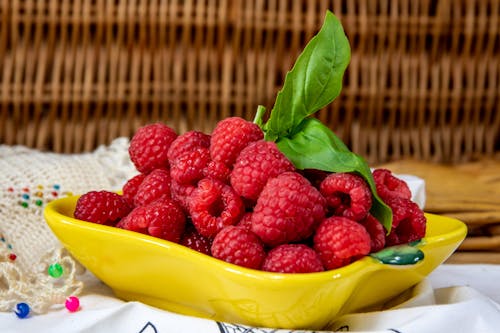 Free Close-Up Photo of Fresh Raspberries in a Yellow Plate Stock Photo