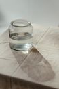 Clear Glass Jar on White Textile