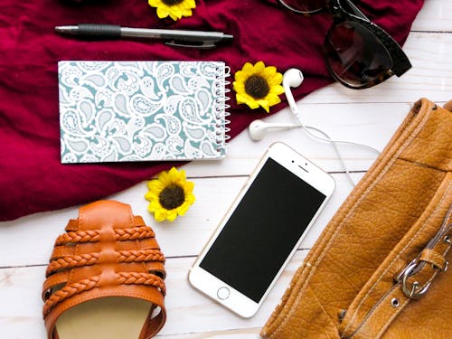 Free Flat Lay Photography of Iphone, Notebook, and Retractable Pen Stock Photo