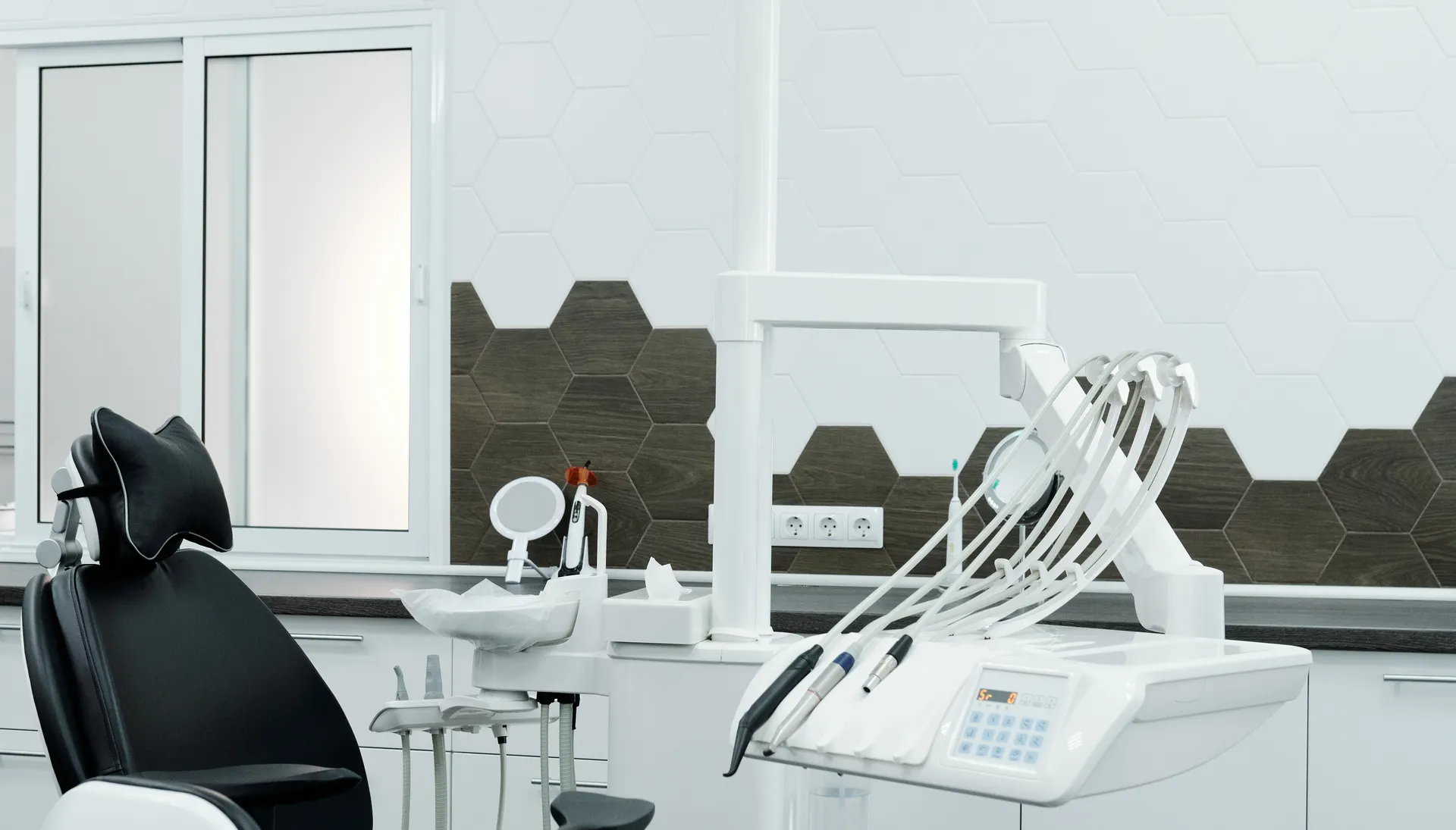 Contemporary dental operatory with an empty treatment chair